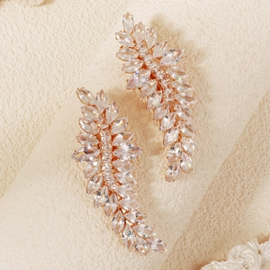Close-up of rose gold leaf earrings with sparkling marquise-cut marquise-cut zircon stones