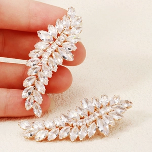Detailed macro view of wheat leaf hair clip with shiny marquise cut cubic zirconia stones