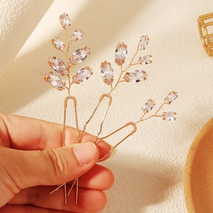Dettagli di forcine per capelli da sposa oro rosa con cristalli marquise e filo intrecciato