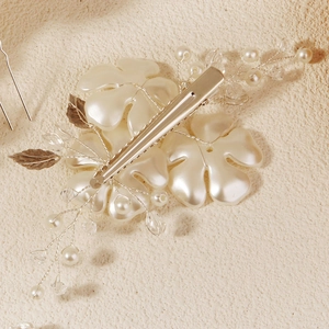 Elegant bridal hair clip set with handmade white acrylic flowers and pearls on silver base