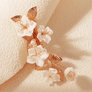 Handmade floral hair clip with gold leaves, white petals, pearls and crystal beads