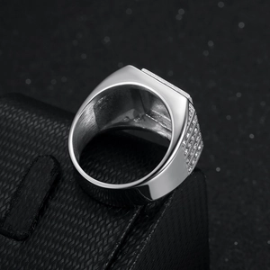 Luxurious silver signet ring with micro-paved rhinestones on a premium black jewelry box