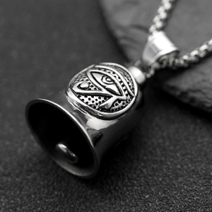 Steel bell necklace with Eye of Horus relief on grey rock background, 61cm chain