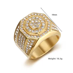 Macro detail of luxury gold hexagonal hip hop ring with white cubic zirconia stones