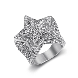 Macro shot of hip-hop pentagram ring with iced-out pave diamonds on wide steel band