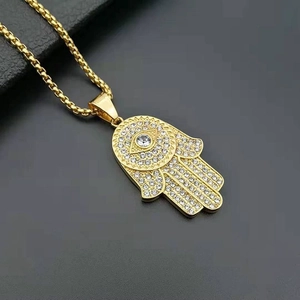 Hamsa hand necklace in gold plated titanium steel with micro paved sparkling zircon stones