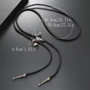 Western vintage bolo tie featuring a ram skull pendant with black braided leather cord