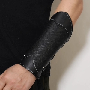 Vintage black leather forearm guard with snakeskin texture and silver rivet studs