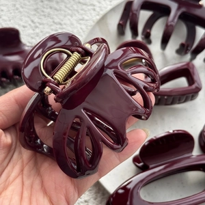 Deep burgundy geometric hair claw clips with premium gold-plated metal springs for women
