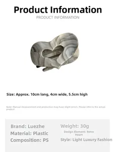 Detail view of large heart-shaped hair claw clip with vintage grey marble pattern in PS plastic