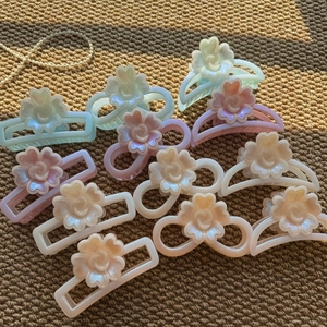 Colorful floral hair claw clips set in pastel shades like blue and pink for women
