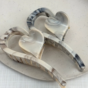 Large ink marble heart-shaped hair claw clips for women with thick hair in ceramic tray