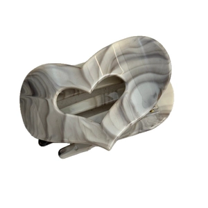 Vintage heart-shaped hair claw with grey marble ink pattern for women, white background