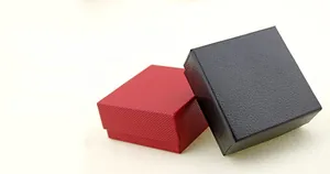 Detail view of premium square faux leather ring boxes in elegant red and black colors