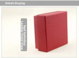 Detail view of red faux leather jewelry gift box with textured lychee grain surface