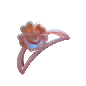 Pink iridescent floral hair claw clip with pearlescent finish and heart-shaped petals