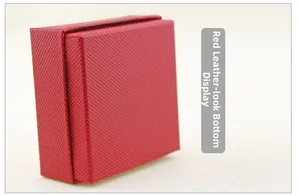 Detail view of the red faux leather jewelry box with textured finish and sturdy base