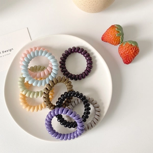 Colorful spiral phone cord hair ties set in pastel shades for girls hair styling