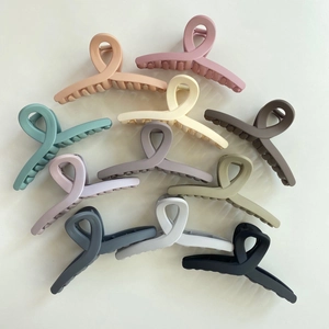 Elegant 10-piece matte hair claw clip set with minimalist crossed design in morandi colors