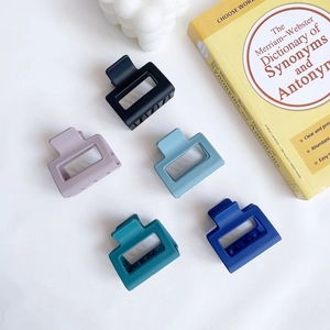 Five matte square hollow hair claws in Morandi colors shown on a white surface