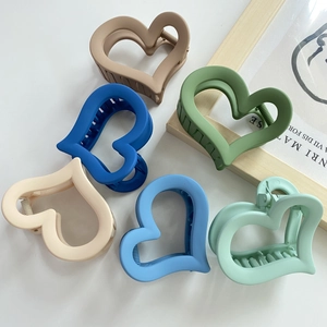 Set of six matte heart-shaped hair claw clips in assorted soft pastel aesthetic colors