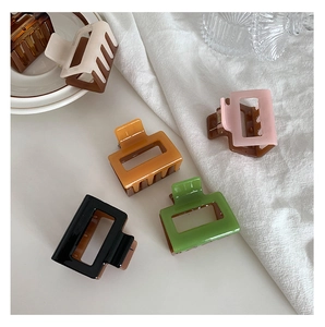 Five assorted 5cm hollow square hair claws in brown and multi-color for stylish updos