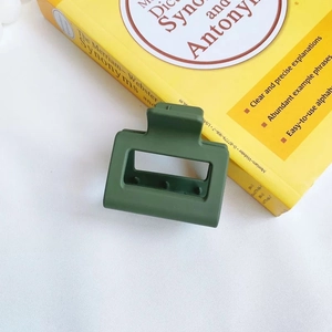 Matte dark green rectangular hair claw clip with hollow design in Korean minimalist style