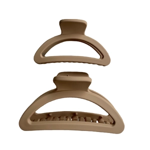 Matte brown geometric hair claws in large and small sizes on a clean white background