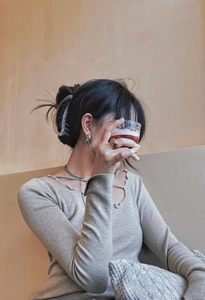 Matte jelly crescent hair claw clip and minimalist jewelry worn by a female model