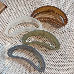 Detail showing four assorted jelly colors of large 13cm crescent-shaped hair claw clips