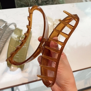 Detailed view of large crescent jelly color hair claws with durable metal springs