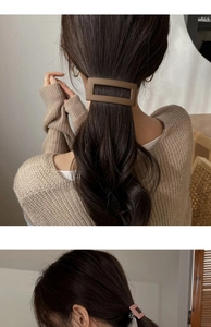 Detail view of a matte brown barrette and small pink hair claw clip in a cozy setting