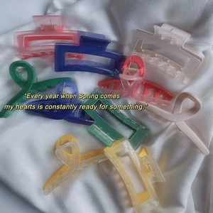 Collection of colorful acrylic hair claws in rectangular and crisscross designs for women