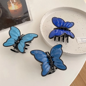 Three elegant blue butterfly hair claws in sky, Prussian, and royal blue shades