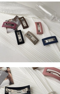 Detail of matte rectangular hollow hair clips in six elegant colors with metal spring base