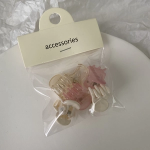 Mini pastel jelly plastic hair claw clips set shown in various colors on white plate