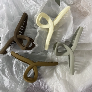 Extra large 13cm matte hair claw clips in earth tones for thick hair styling