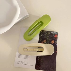 Minimalist large matte hair claws in cream white and avocado green for elegant updos