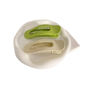 Minimalist matte cream and green wavy hair claw clips set displayed on white tray