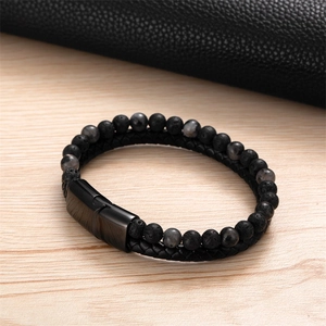Bracciale da uomo con perline di pietra lavica nera e cinturino in pelle intrecciata con chiusura