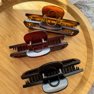 Three large 12cm rectangular hair claws in amber, burgundy and matte black set