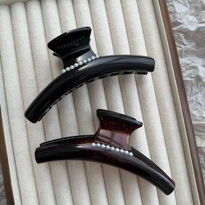 French style curved pearl hair claws in polished black and dark tortoiseshell finishes