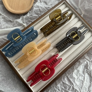 Set of five colorful resin hair claws with gold springs in various jelly colors