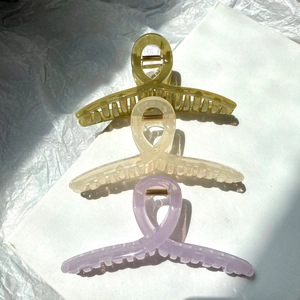 Three-piece large shark hair clips set in olive, cream, and lavender jelly colors