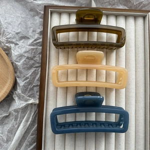 Set of three large rectangular jelly hair claws in green, yellow, and navy blue finishes
