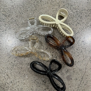 Set of five large hollow bow claw clips in diverse colors for women daily hair styling