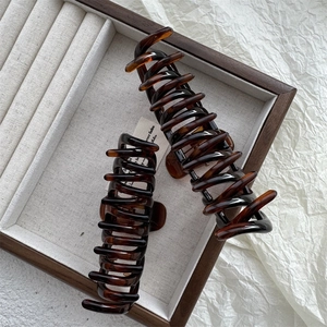 French vintage tortoiseshell hair claw set with two sizes displayed in a premium jewelry tray