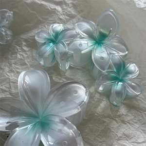 Pinces à cheveux fleurs de frangipanier à dégradé blanc et sarcelle mat pour femme