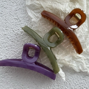 Set of three jelly-colored large hair claws in amber, olive green, and purple resin