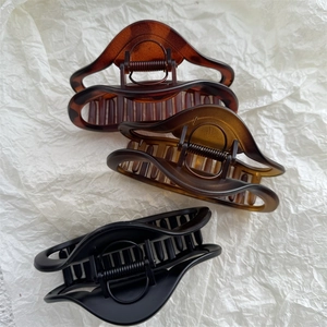 Matte finish large hair claw clip set in tortoiseshell amber and black colors